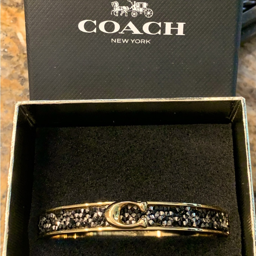 ⭐️💫COACH NEW IN BOX BLACK
CRYSTAL & GOLD
BANGLE STUNNING EYE
CATCHING DE… - Picture 2 of 2